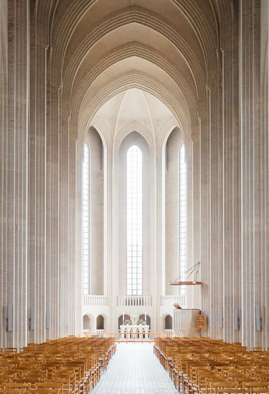 A stark white church with larg pillars