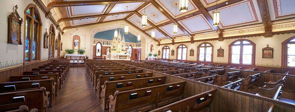 A church with wooden pews and classic lighting